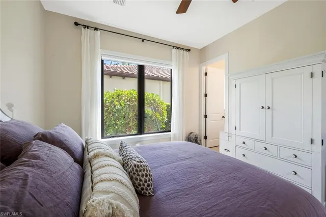 a bed room with a bed and a window