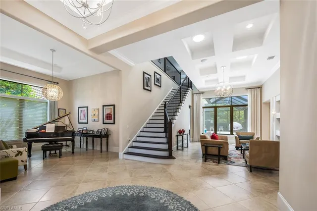 a view of a livingroom with furniture and staircase