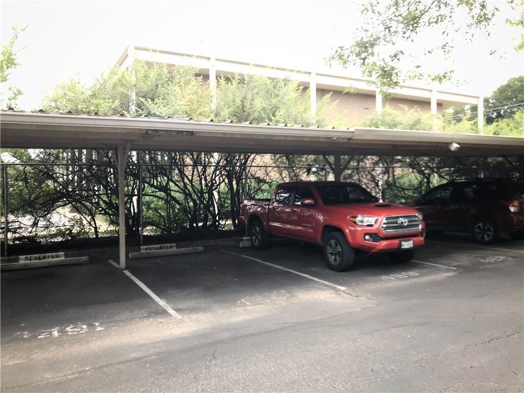 500 East Riverside Drive, Unit 154 Austin, TX 78704 - Photo 11 of 14 Covered parking structure with designated reserved spaces