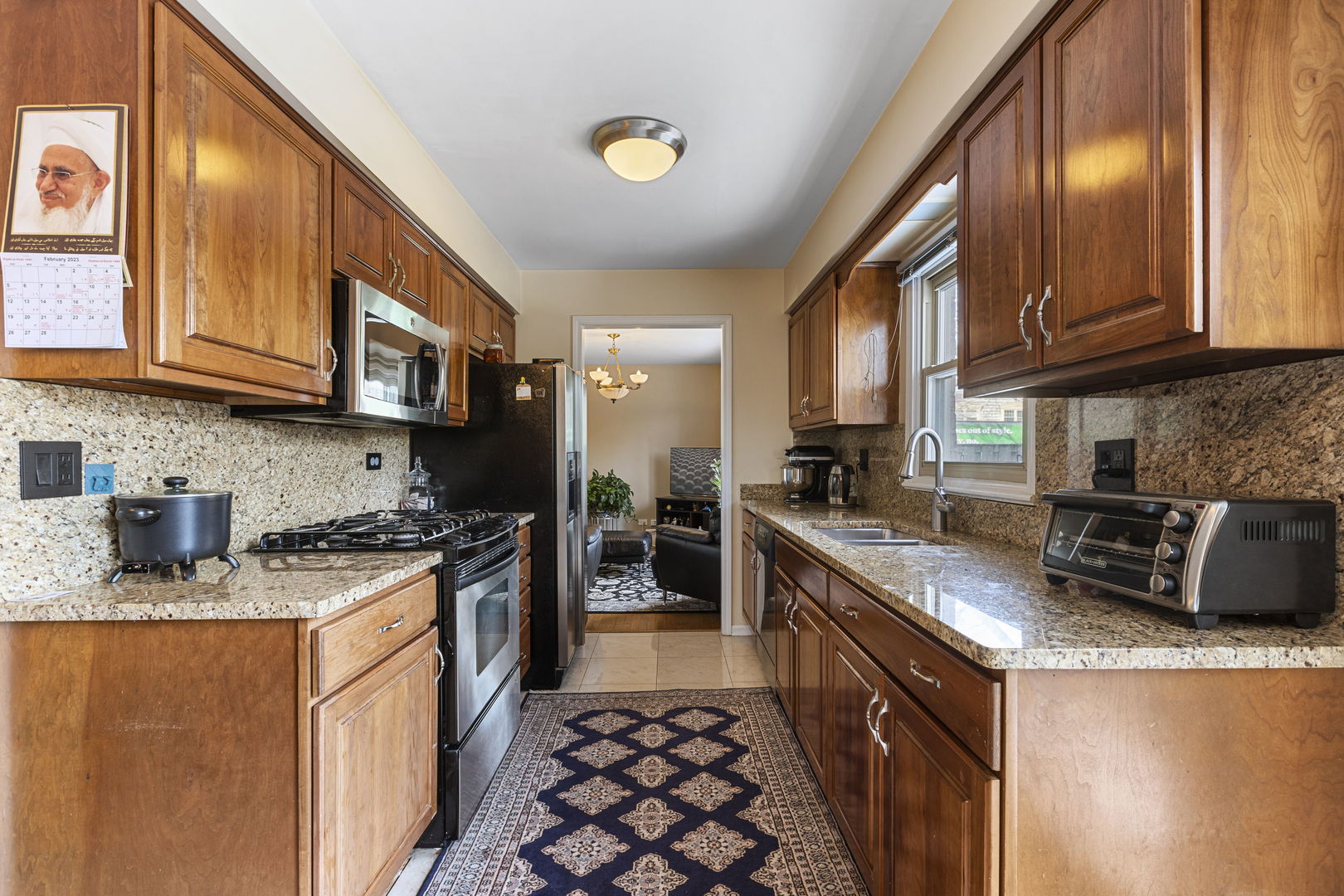 Undisclosed Address Oak Brook, IL 60523 - Photo 6 of 18 a kitchen with stainless steel appliances granite countertop a stove a sink dishwasher and a refrigerator