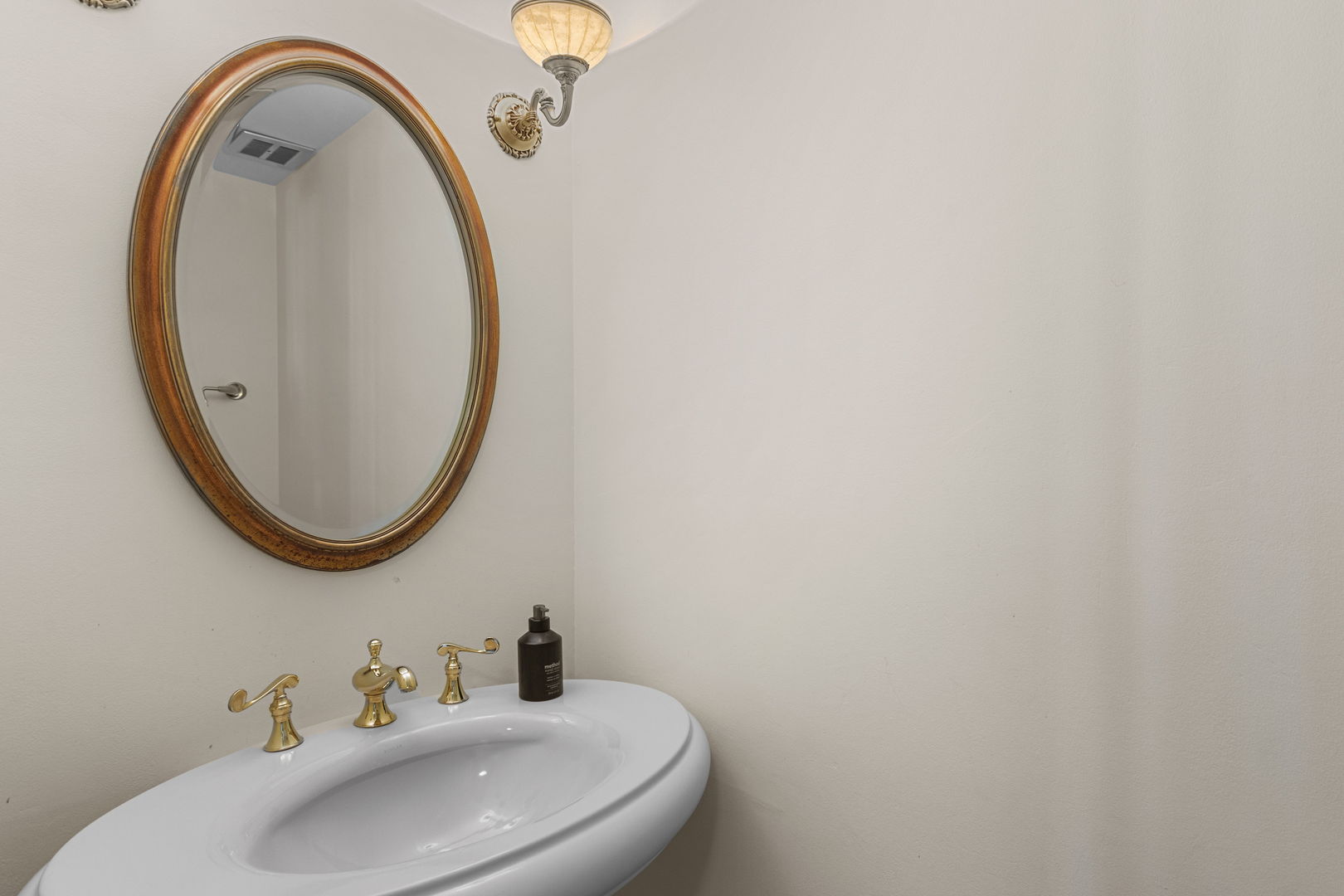 Undisclosed Address Oak Brook, IL 60523 - Photo 8 of 18 a bathroom with a sink and a mirror