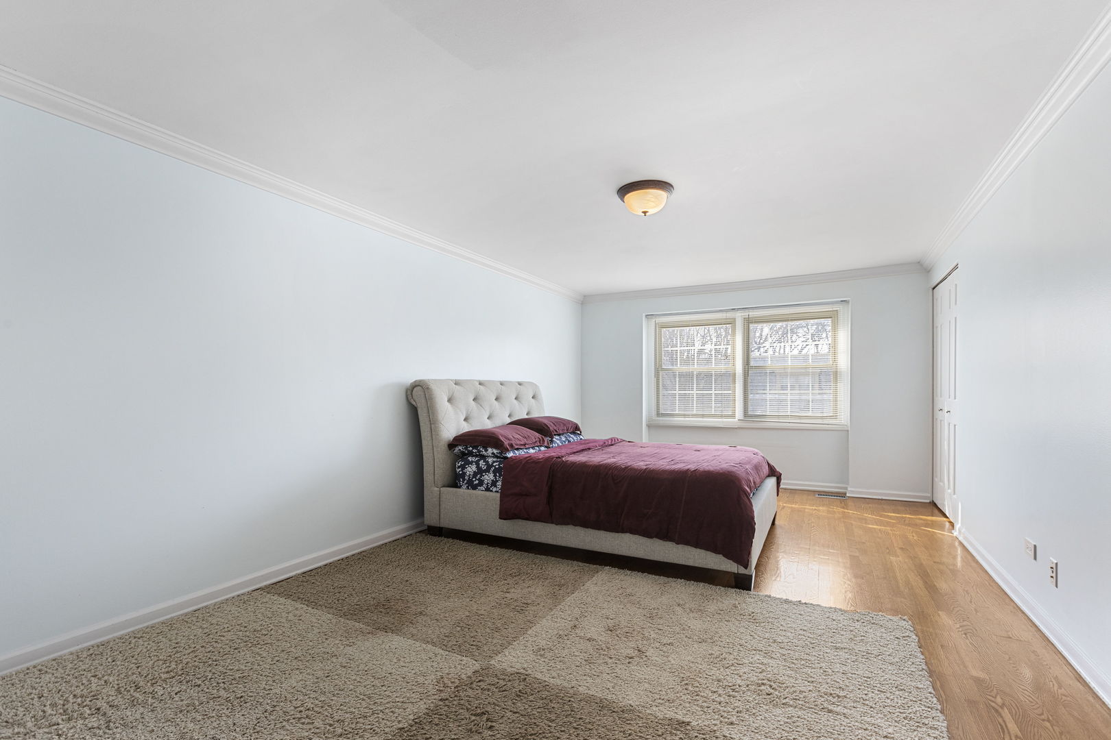 Undisclosed Address Oak Brook, IL 60523 - Photo 9 of 18 a room with a bed and a window