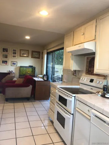 a kitchen with a stove a sink and a microwave