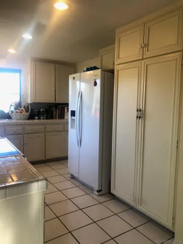 a kitchen with stainless steel appliances a refrigerator and a sink