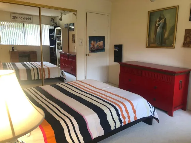 a bedroom with bed and window