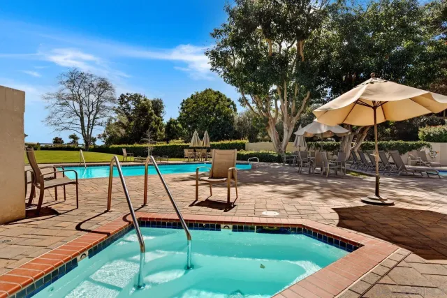 a view of a swimming pool with a patio