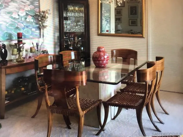 a dining room with furniture and window
