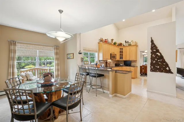 a view of a dining room with furniture window and outside view