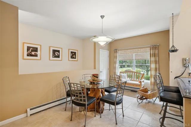 a dining room with furniture and window