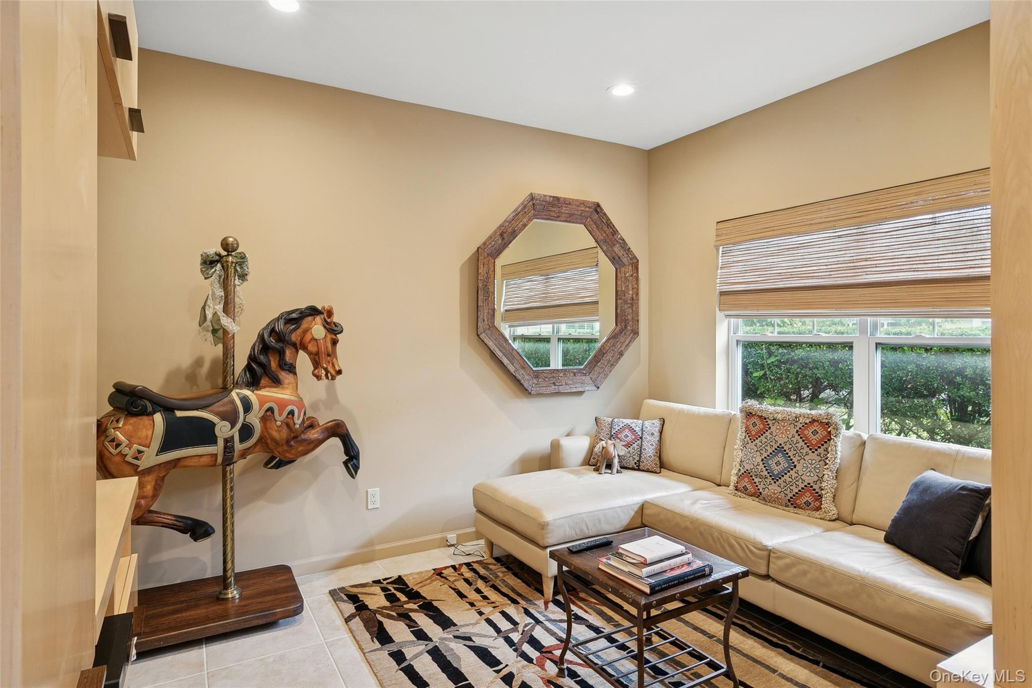 103 Rivendell Court Melville, NY 11747 - Photo 19 of 47 Living area with light tile patterned floors and recessed lighting