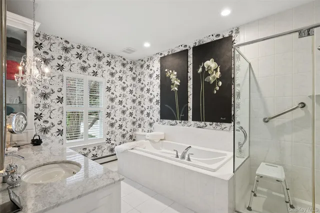 a bathroom with a granite countertop sink a toilet and shower