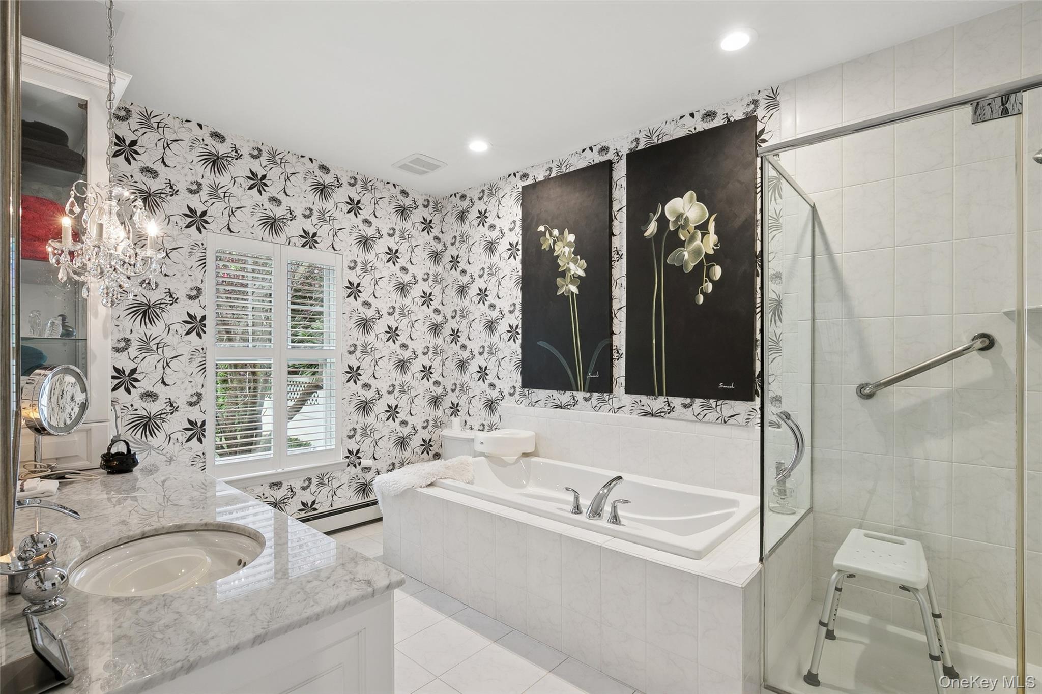 103 Rivendell Court Melville, NY 11747 - Photo 27 of 47 Full bathroom featuring a bath, a stall shower, double vanity, light tile patterned flooring, and wallpapered walls