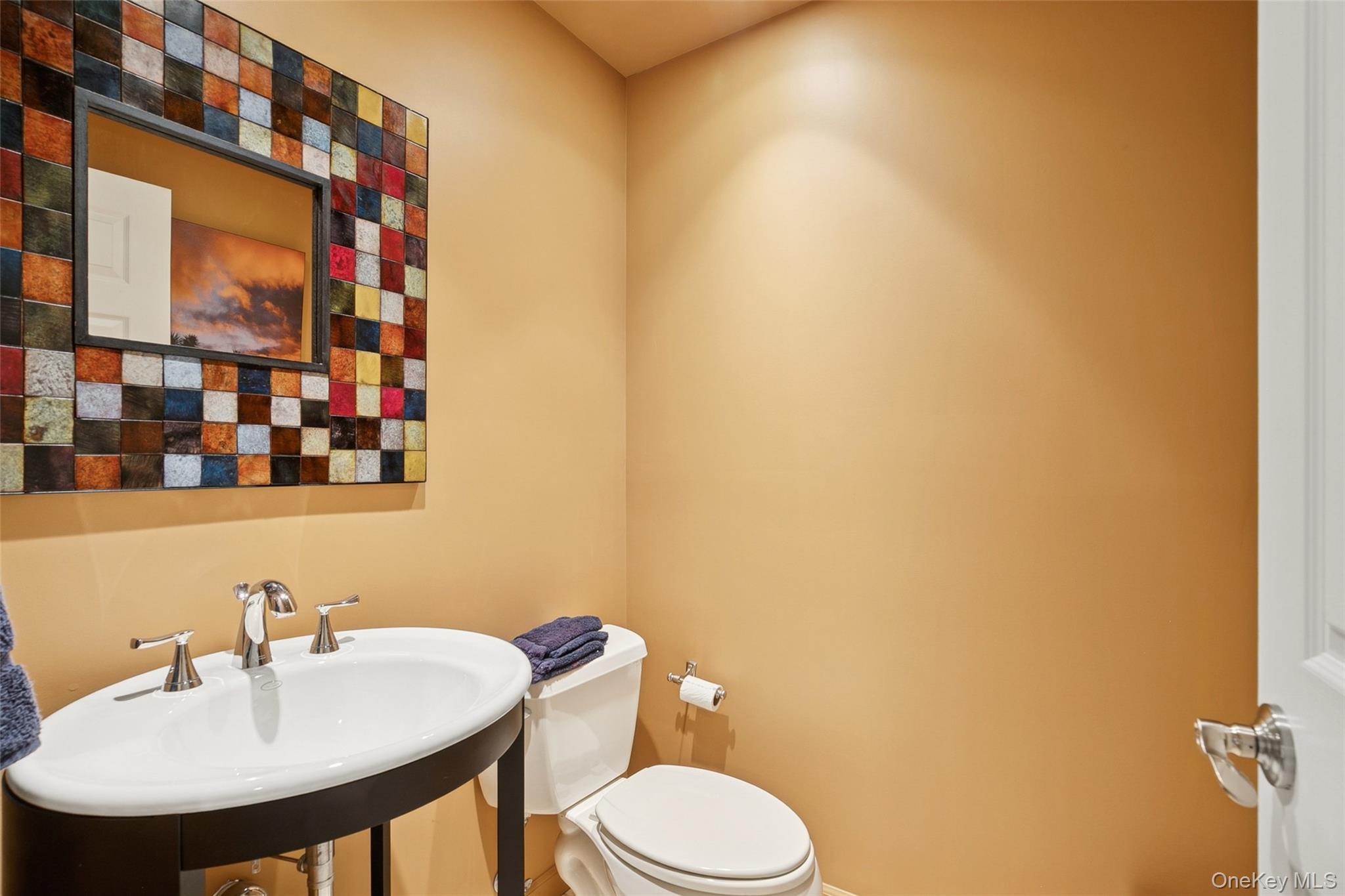 103 Rivendell Court Melville, NY 11747 - Photo 32 of 47 Half bathroom featuring toilet and a sink