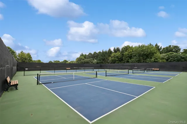 a view of an outdoor space and tennis court