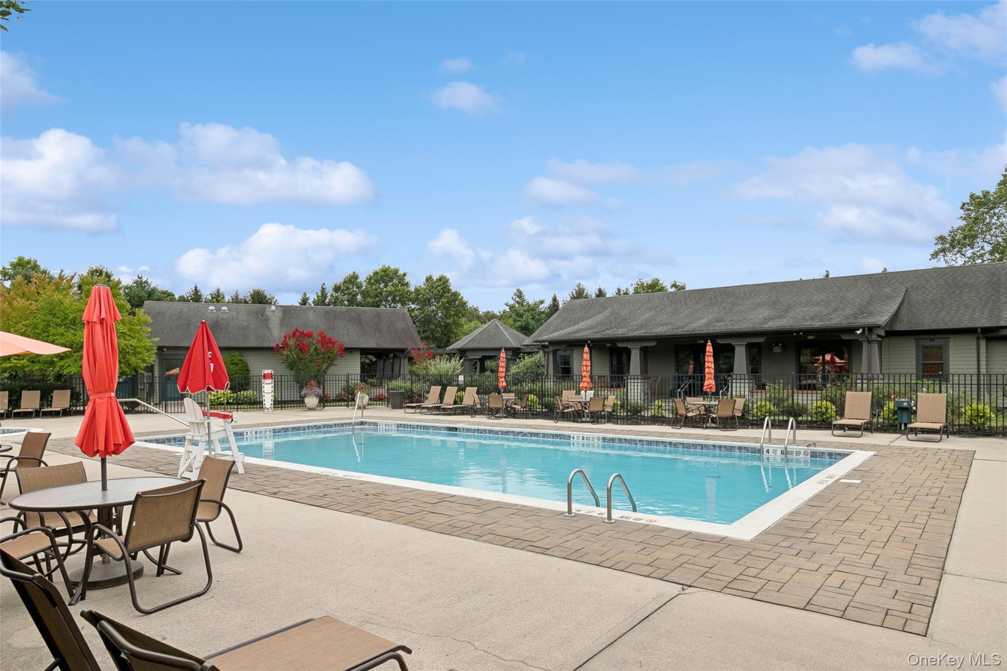103 Rivendell Court Melville, NY 11747 - Photo 44 of 47 Community pool with a patio area