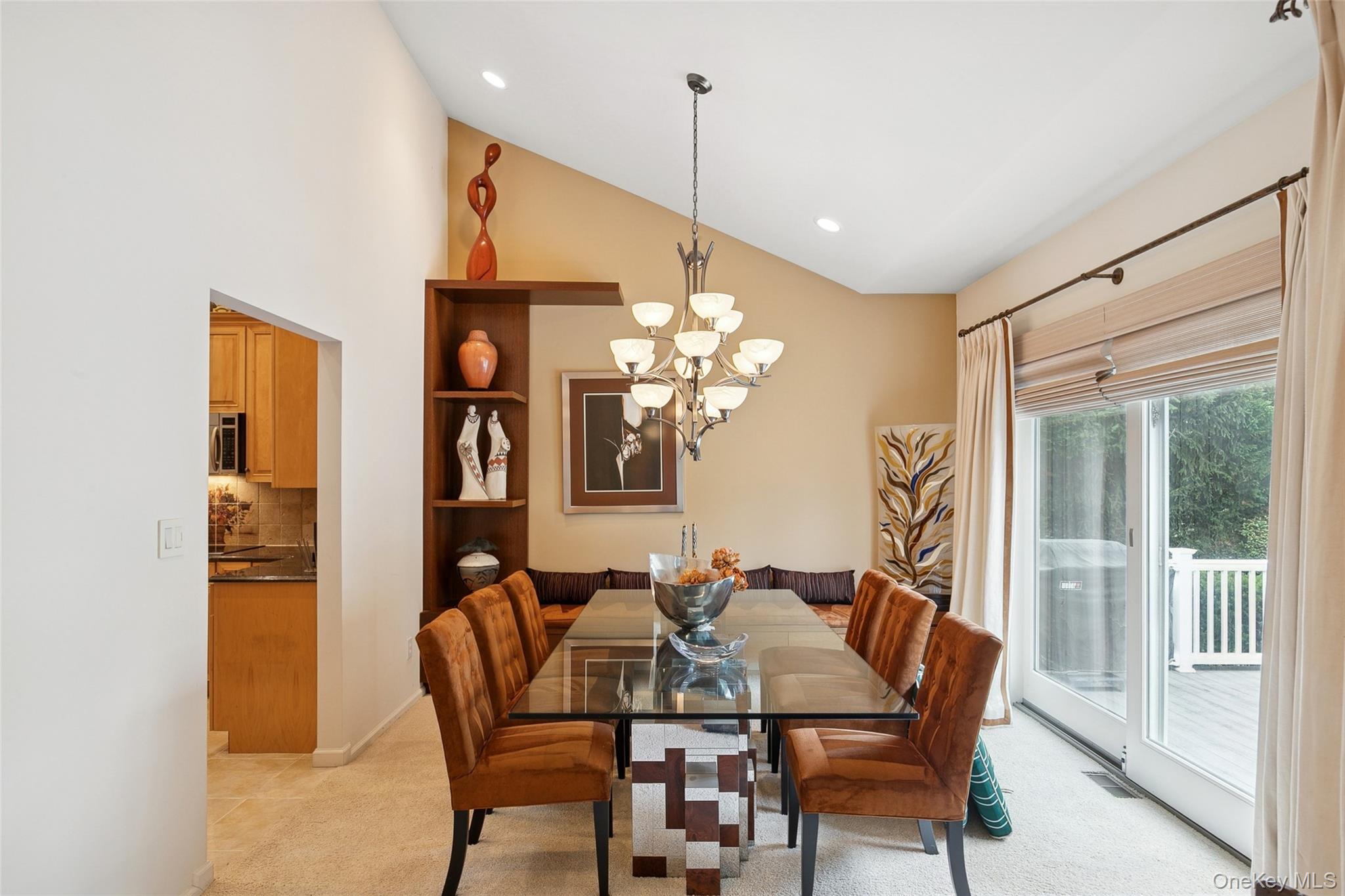 103 Rivendell Court Melville, NY 11747 - Photo 9 of 47 Dining space featuring a chandelier, light carpet, recessed lighting, and high vaulted ceiling