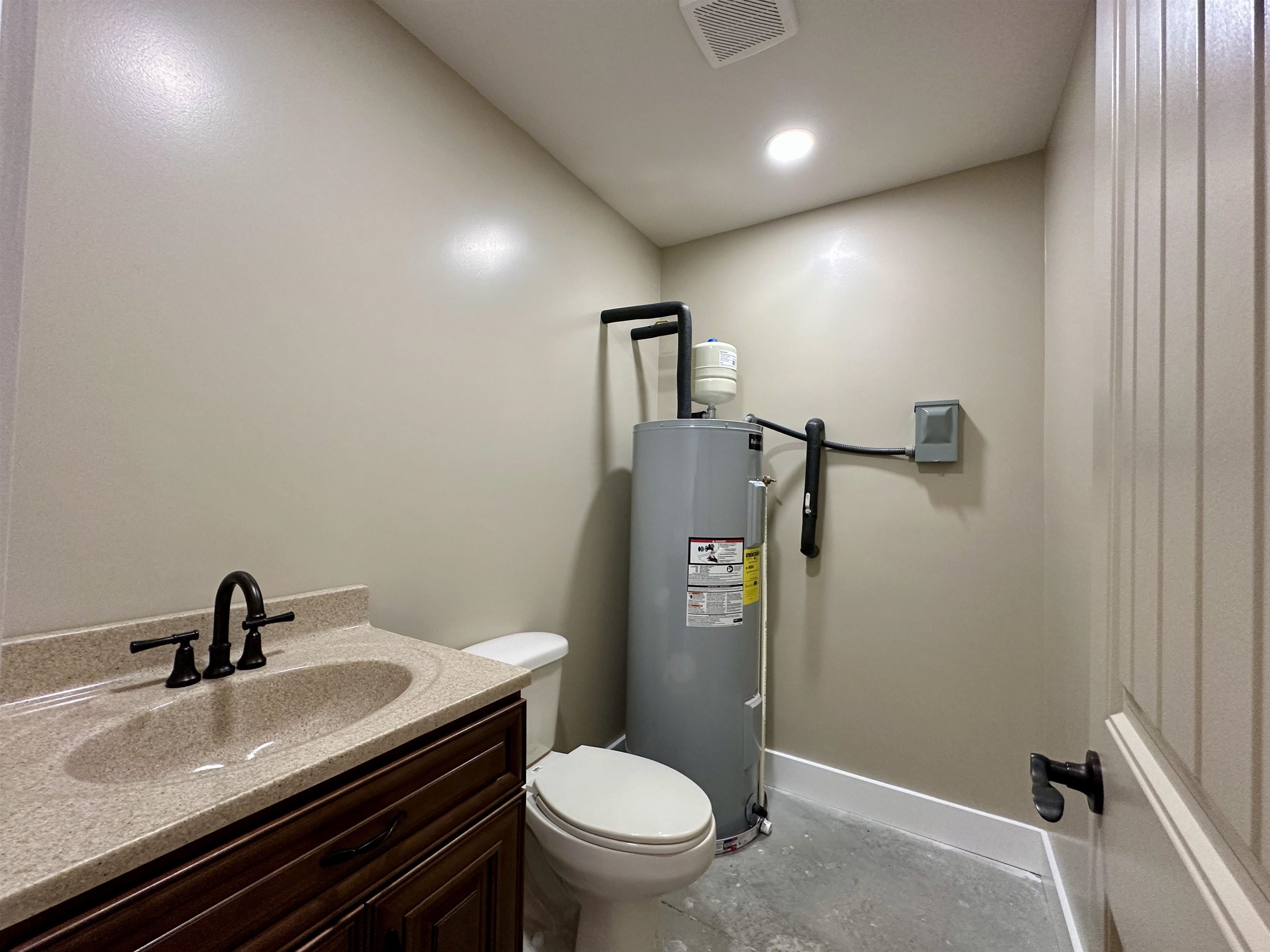 1137 Arl Bailey Road Finger, TN 38334 - Photo 26 of 40 a bathroom with a granite countertop sink toilet and mirror