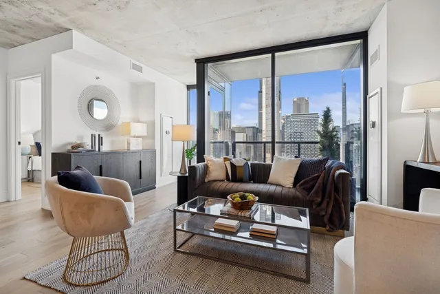 a living room with furniture and a large window