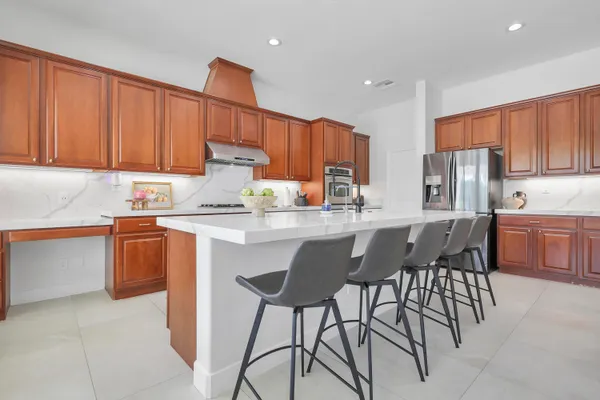 a kitchen with a sink cabinets and window