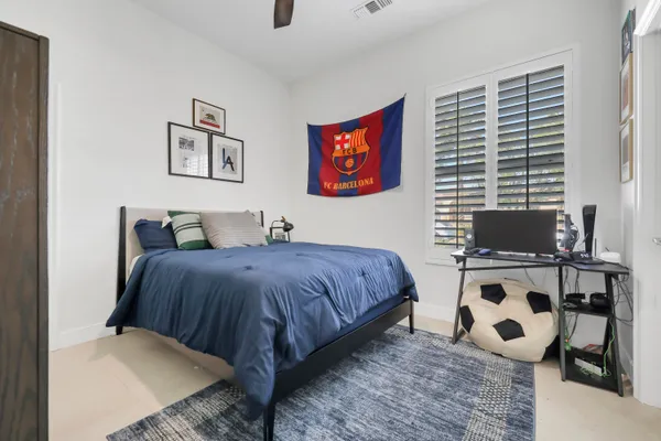 a bathroom with double vanity sink and mirror