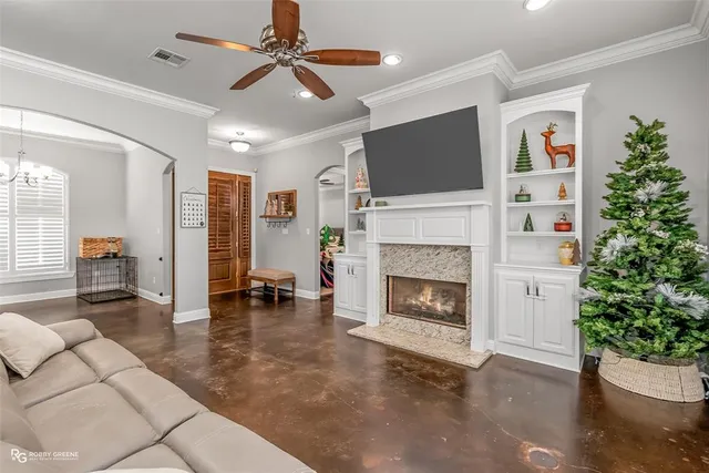 a living room with furniture and a fireplace