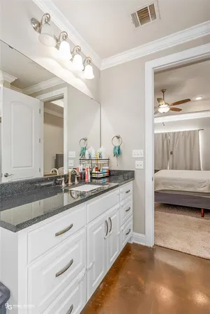 a en suite bathroom with double sink and a mirror