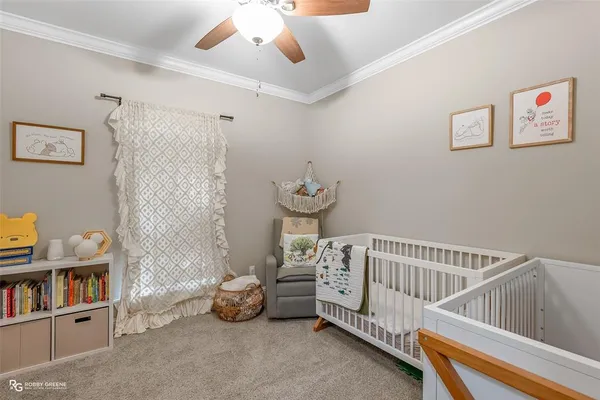a bedroom with furniture and a book shelf