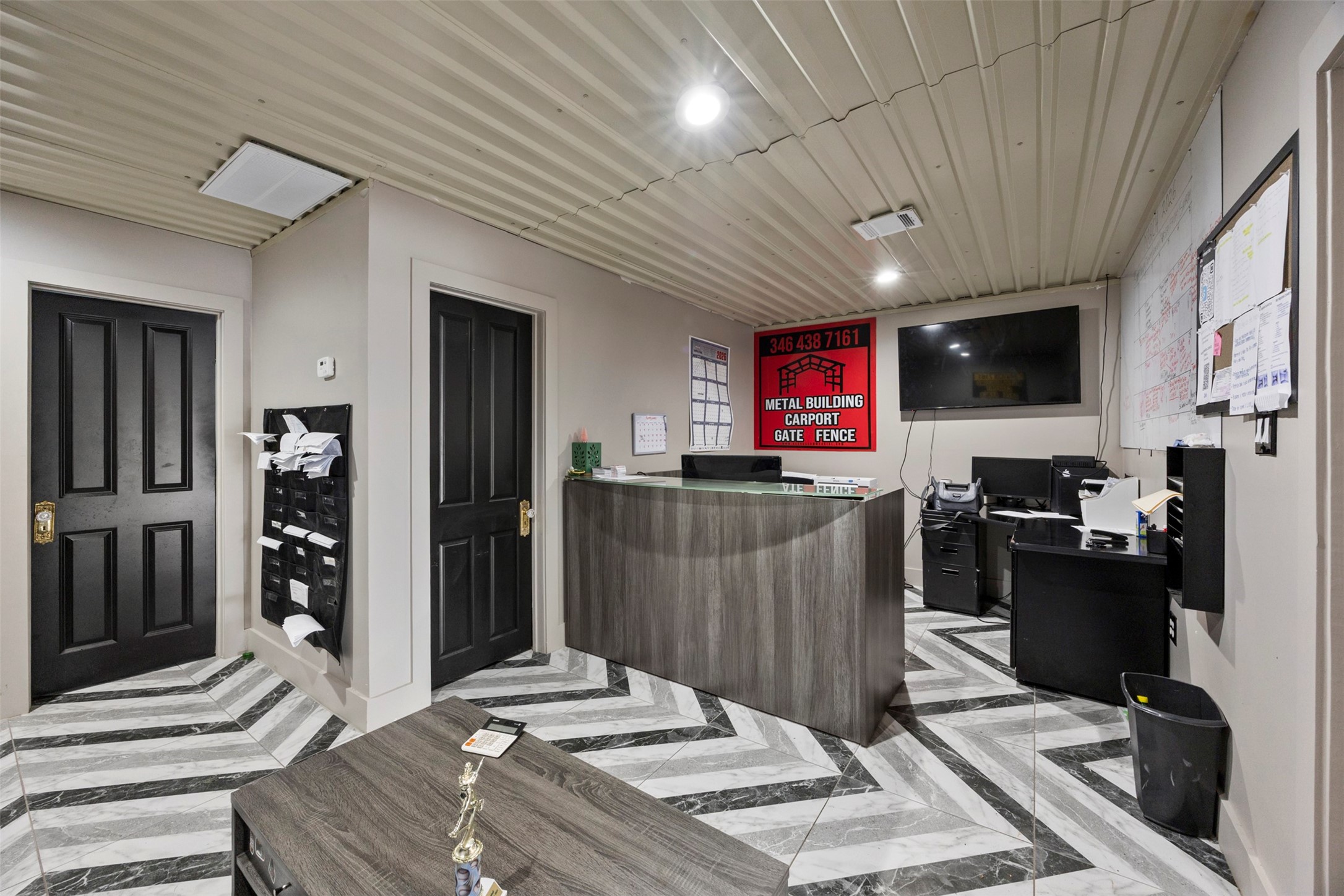 10430 Caxton Street Houston, TX 77016 - Photo 17 of 26 a bedroom with a bed and a flat screen tv