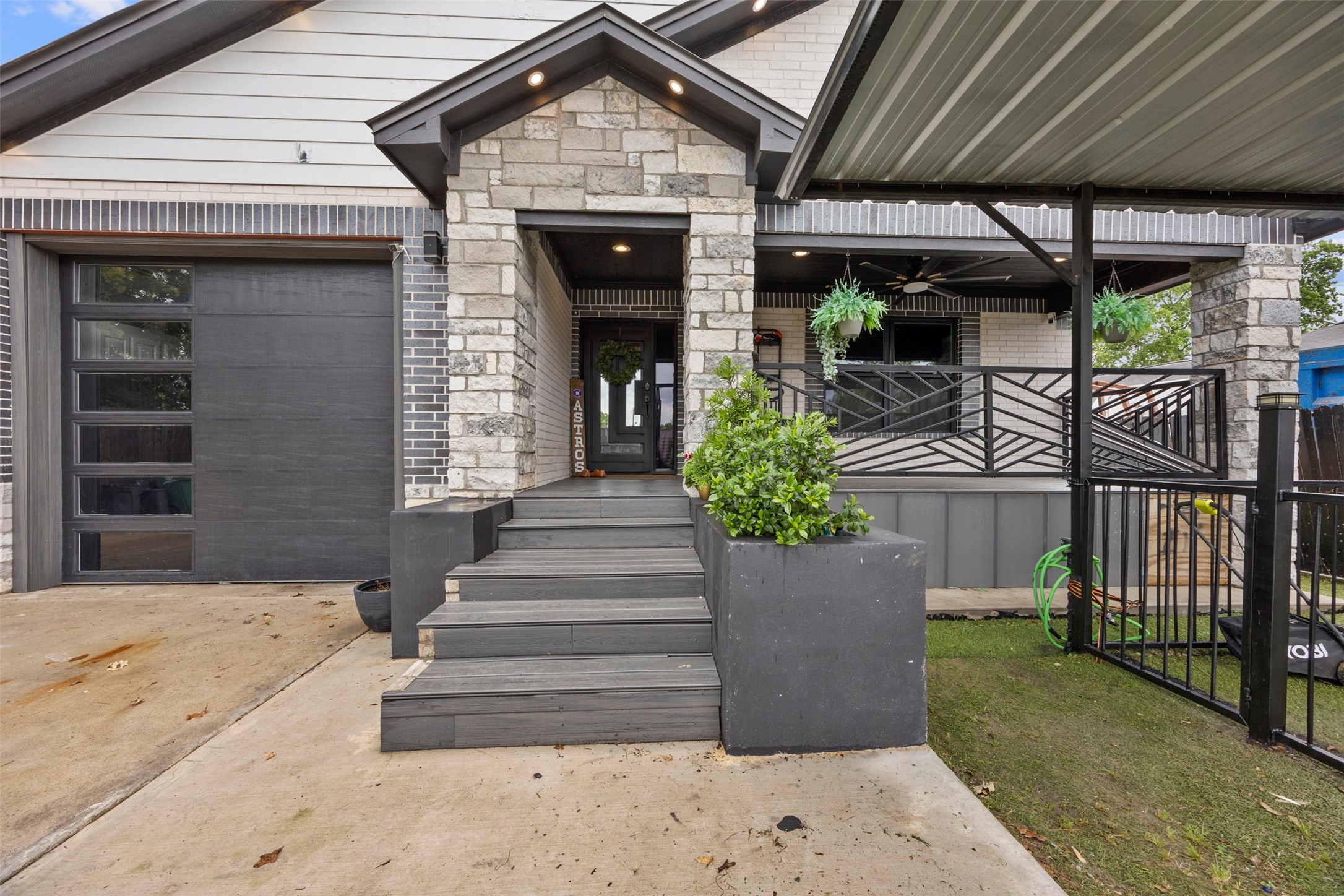 10430 Caxton Street Houston, TX 77016 - Photo 3 of 26 a front view of a house with a porch