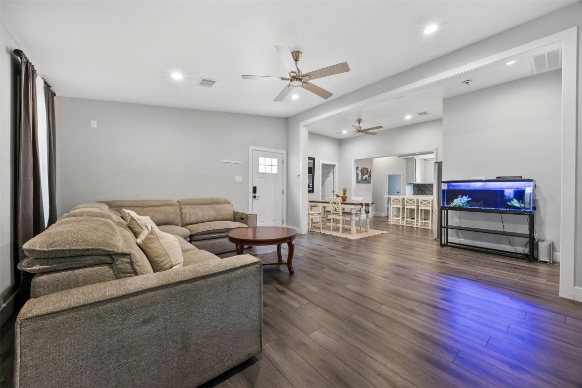 10430 Caxton Street Houston, TX 77016 - Photo 8 of 26 a living room with furniture and a wooden floor
