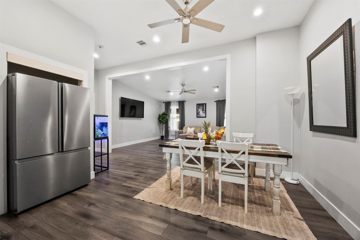 10430 Caxton Street Houston, TX 77016 - Photo 9 of 26 a view of a dining room with furniture and wooden floor