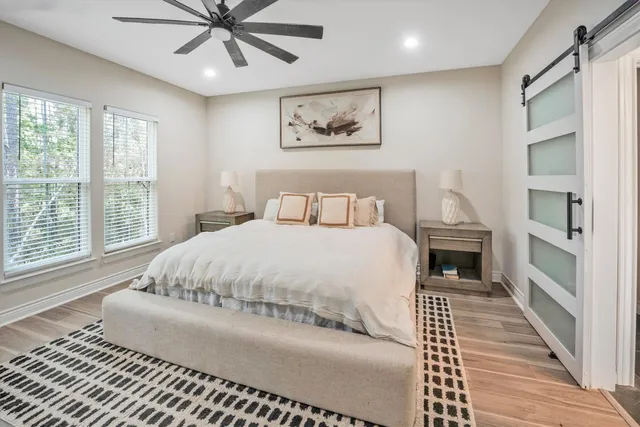 a large white bed in a white room