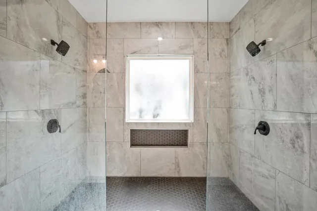 a bathroom with a shower and a bathtub