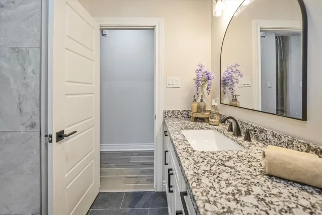 a bathroom with a sink and a mirror