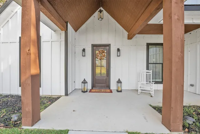 a view of an entrance to house with yard