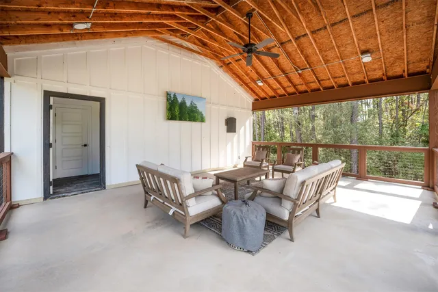 a view of a house with a garden and yard