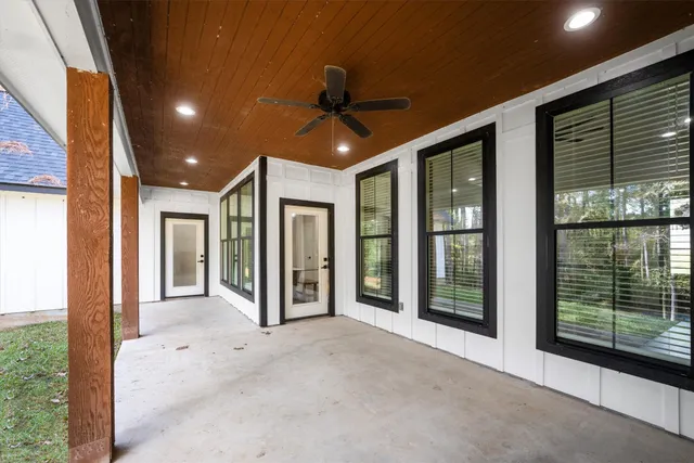 a view of a room with porch and a yard