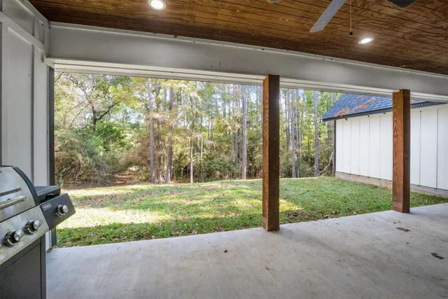 view of a lake with a yard