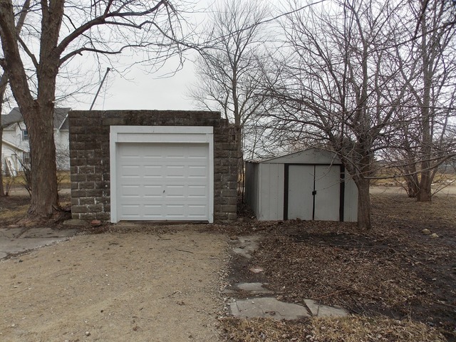 2265 North 3806th Road Serena, IL 60549 - Photo 18 of 19 a view of a house with a large tree and a yard