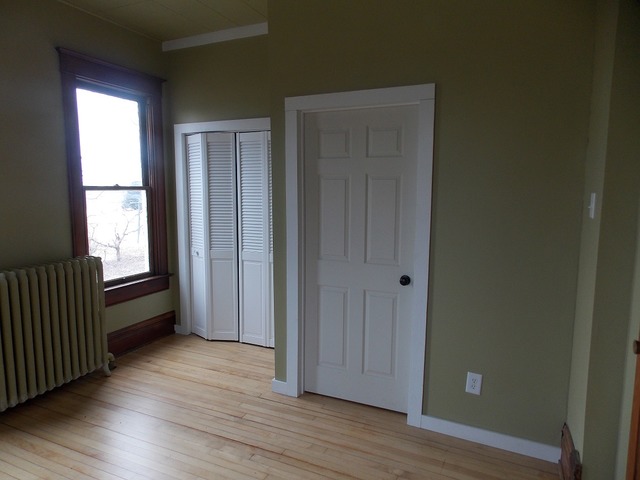 2265 North 3806th Road Serena, IL 60549 - Photo 6 of 19 an empty room with wooden floor and windows