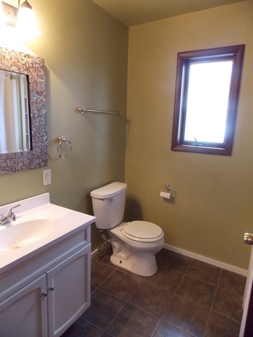 2265 North 3806th Road Serena, IL 60549 - Photo 10 of 19 a bathroom with a toilet sink and mirror