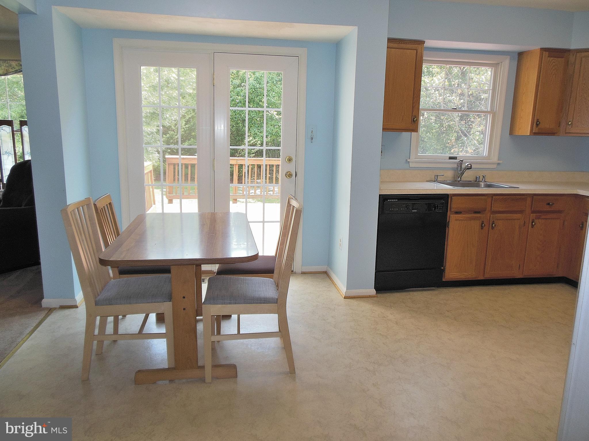4324 Cottington Road Baltimore, MD 21236 - Photo 4 of 21 Kitchen opens onto deck