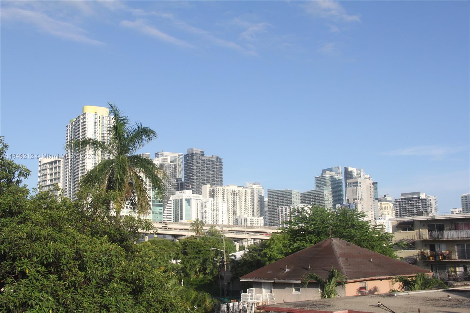 450 Southwest 3rd Street, Unit 10 Miami, FL 33130 - Photo 6 of 13 a view of a city with tall buildings