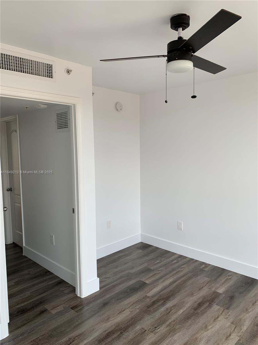 450 Southwest 3rd Street, Unit 10 Miami, FL 33130 - Photo 9 of 13 a view of a room with wooden floor