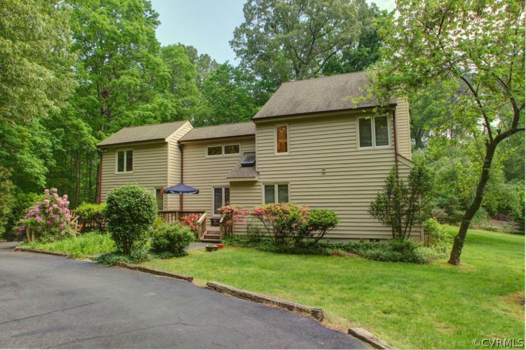 12211 Spring Run Road Chesterfield, VA 23832 - Photo 1 of 24 a view of a house with a yard and plants