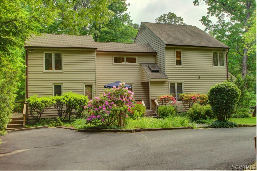 12211 Spring Run Road Chesterfield, VA 23832 - Photo 2 of 24 a front view of a house with a garden