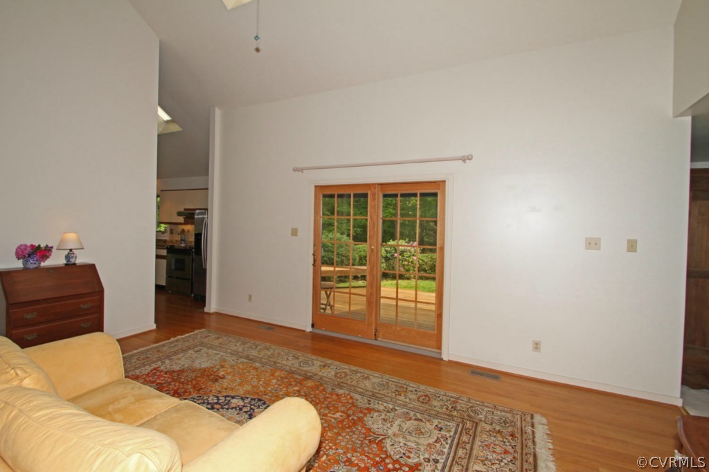 12211 Spring Run Road Chesterfield, VA 23832 - Photo 3 of 24 a bedroom with a bed and wooden floor