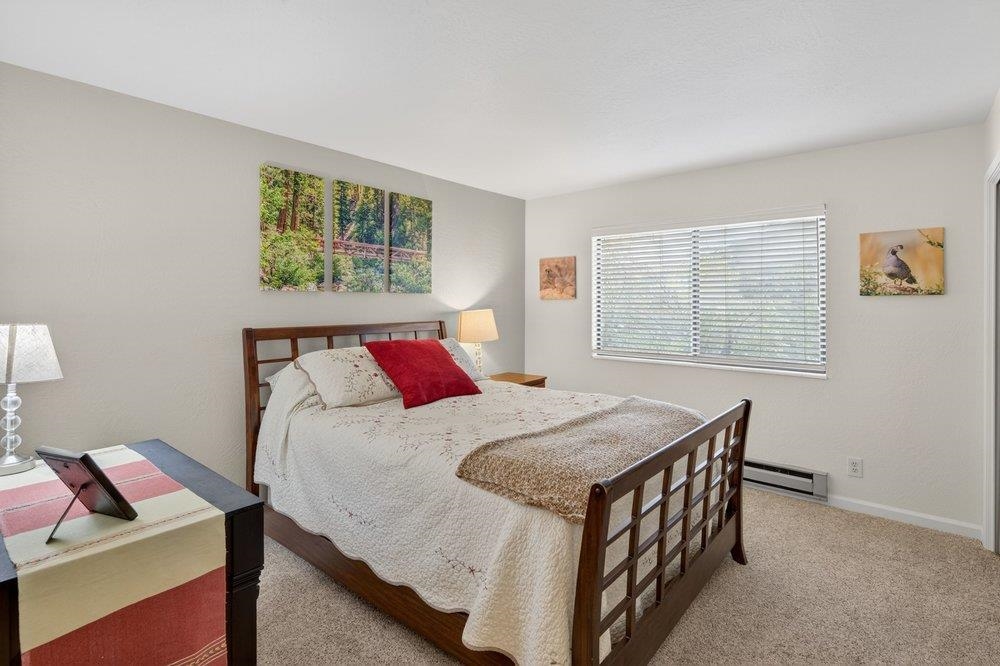 112 Poplar Valley Road Blairsden, CA 96103 - Photo 13 of 28 a bedroom with a bed and a table in it