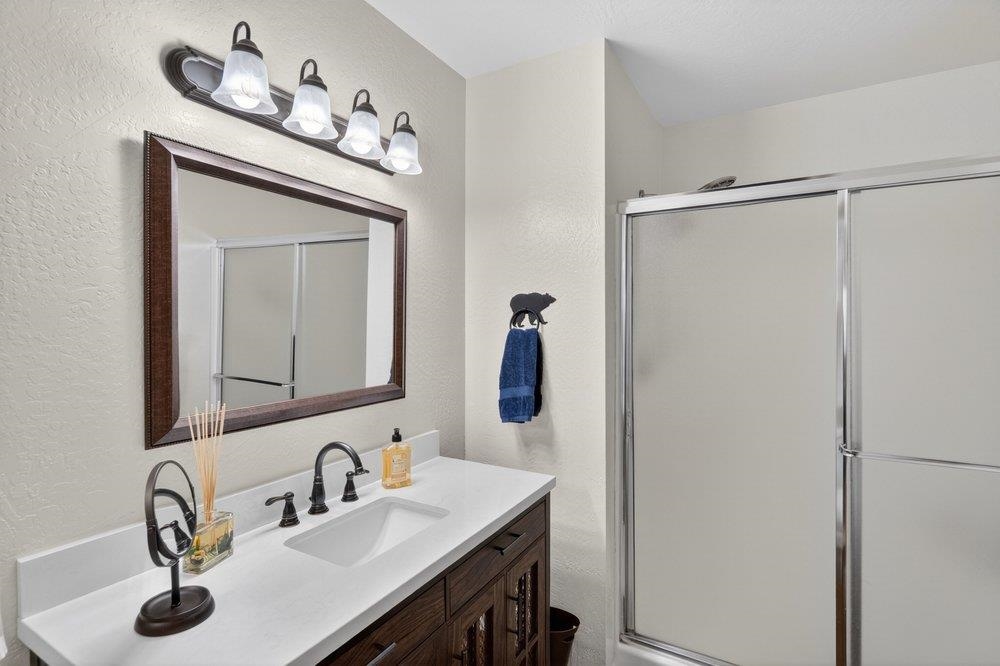 112 Poplar Valley Road Blairsden, CA 96103 - Photo 17 of 28 a bathroom with a sink and a mirror