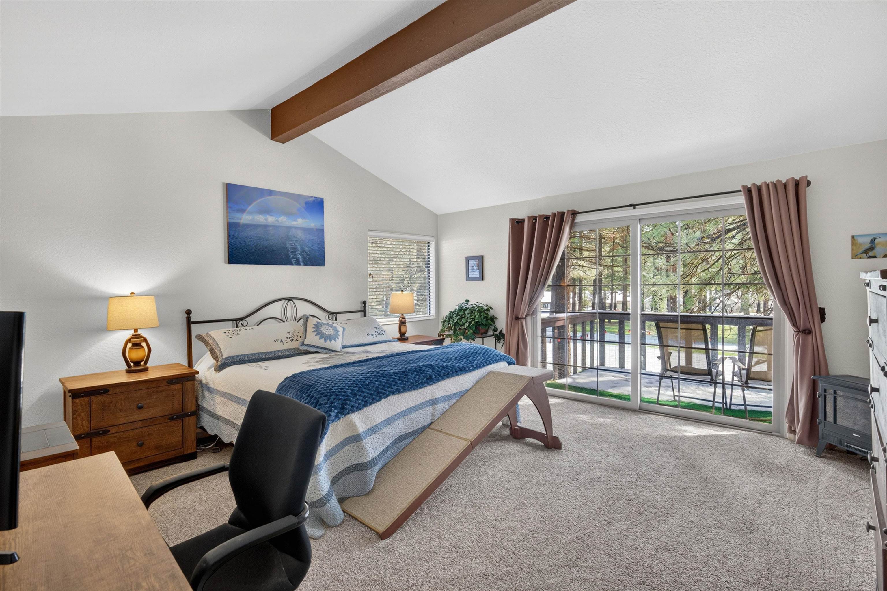 112 Poplar Valley Road Blairsden, CA 96103 - Photo 19 of 28 a spacious bedroom with a bed and a large window